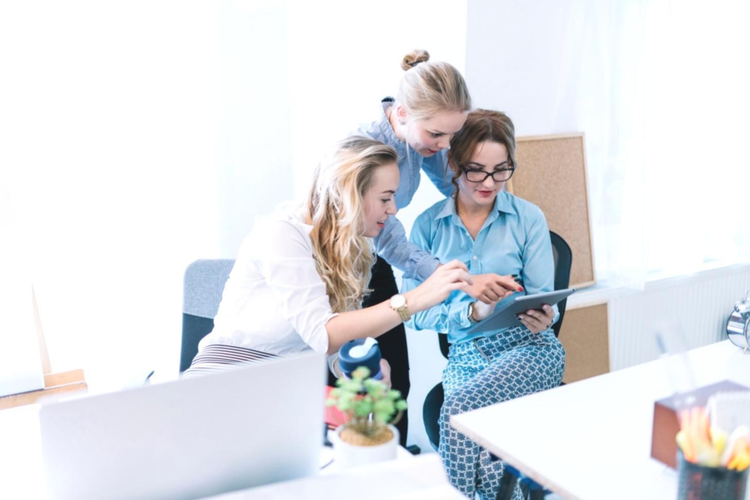 Financial professional reviewing comprehensive investor reports and data visualizations